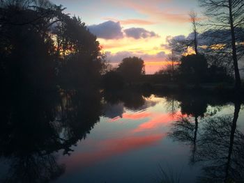 Scenic view of lake at sunset