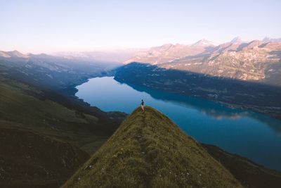 Scenic view of lake against sky at sunset