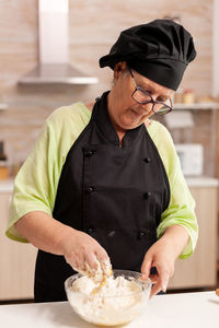 Midsection of man preparing food