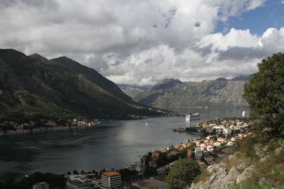 Scenic view of river and mountains against sky