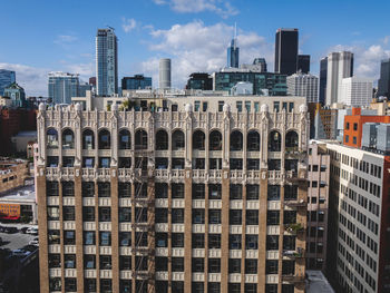 Modern buildings in city against sky