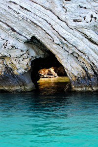 Rock formation on turquoise sea