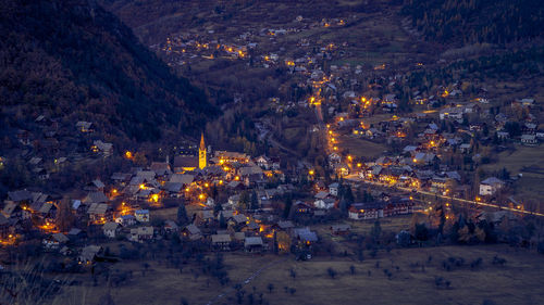 High angle view of illuminated buildings in city