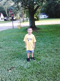 Full length portrait of boy on field