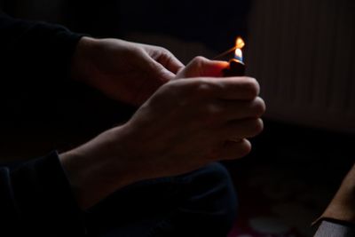 Close-up of man holding hands