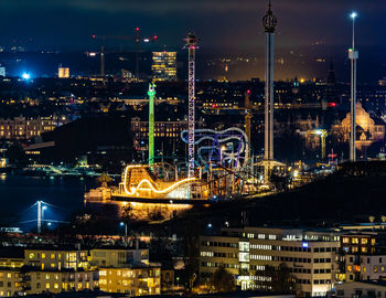 Illuminated buildings in city at night
