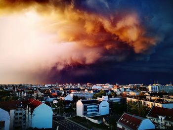 High angle view of illuminated cityscape against sky