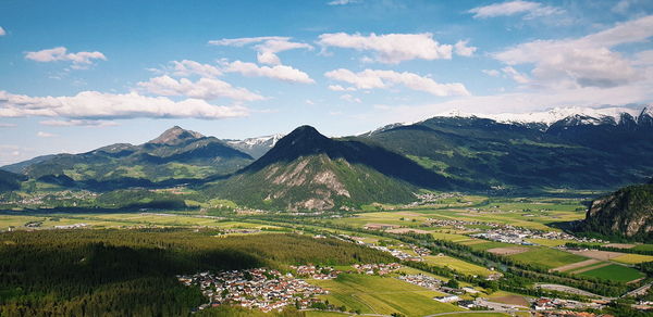 Scenic view of landscape and mountains against sky