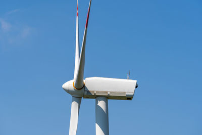 Low angle view of street light against clear blue sky