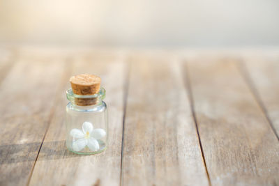 Close-up of glass of jar on table