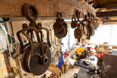 Close-up of padlocks hanging on wood