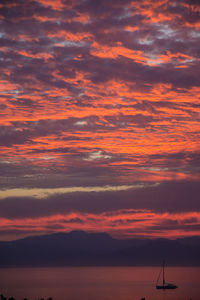 Scenic view of dramatic sky over sea during sunset