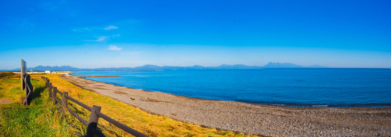 Scenic view of sea against clear blue sky