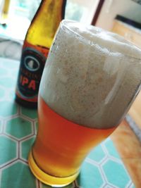 Close-up of beer glass on table