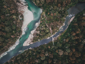 High angle view of water flowing through rocks