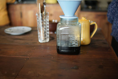 Close-up of glass jar on table