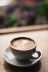 Close-up of cappuccino on table