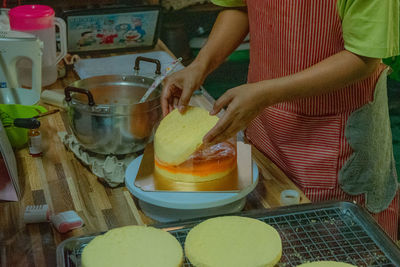Midsection of man preparing food