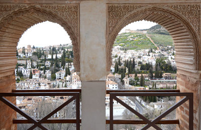 Buildings seen through arch window