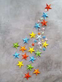 High angle view of colorful umbrellas on paper