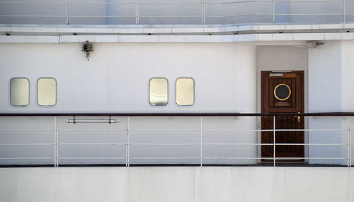 Closed wooden door with window on cruise ship