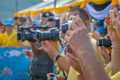 Close-up of people photographing