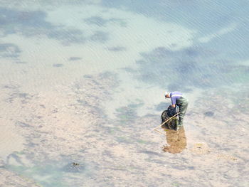 High angle view of man skateboarding on land