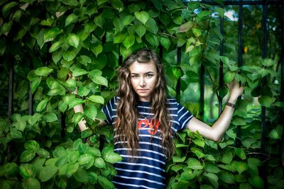 Portrait of young woman with ivy