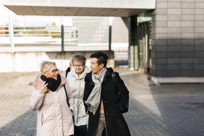 Senior women at train station