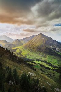 Scenic view of landscape and mountains against sky