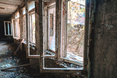 Interior of abandoned house with broken windows in chernobyl
