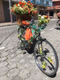 Bicycle parked on footpath by house