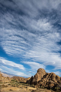 Rock formations on landscape against sky