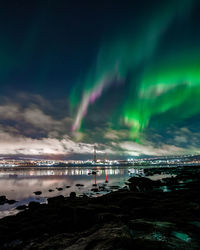 Scenic view of sea against sky at night