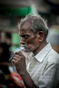 Man smoking cigarette outdoors