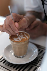 Close-up of coffee cup on table