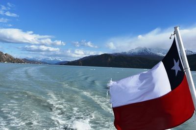 Scenic view of chilean flag against blue sky
