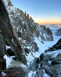 Scenic view of snowcapped mountains against sky during winter