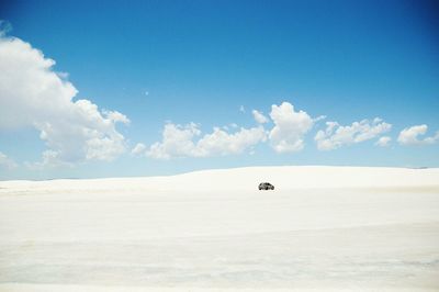 Scenic view of landscape against cloudy sky