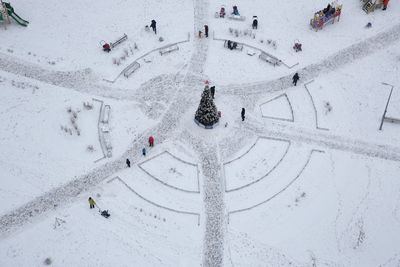 High angle view of people in snow