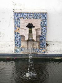 Water fountain against wall