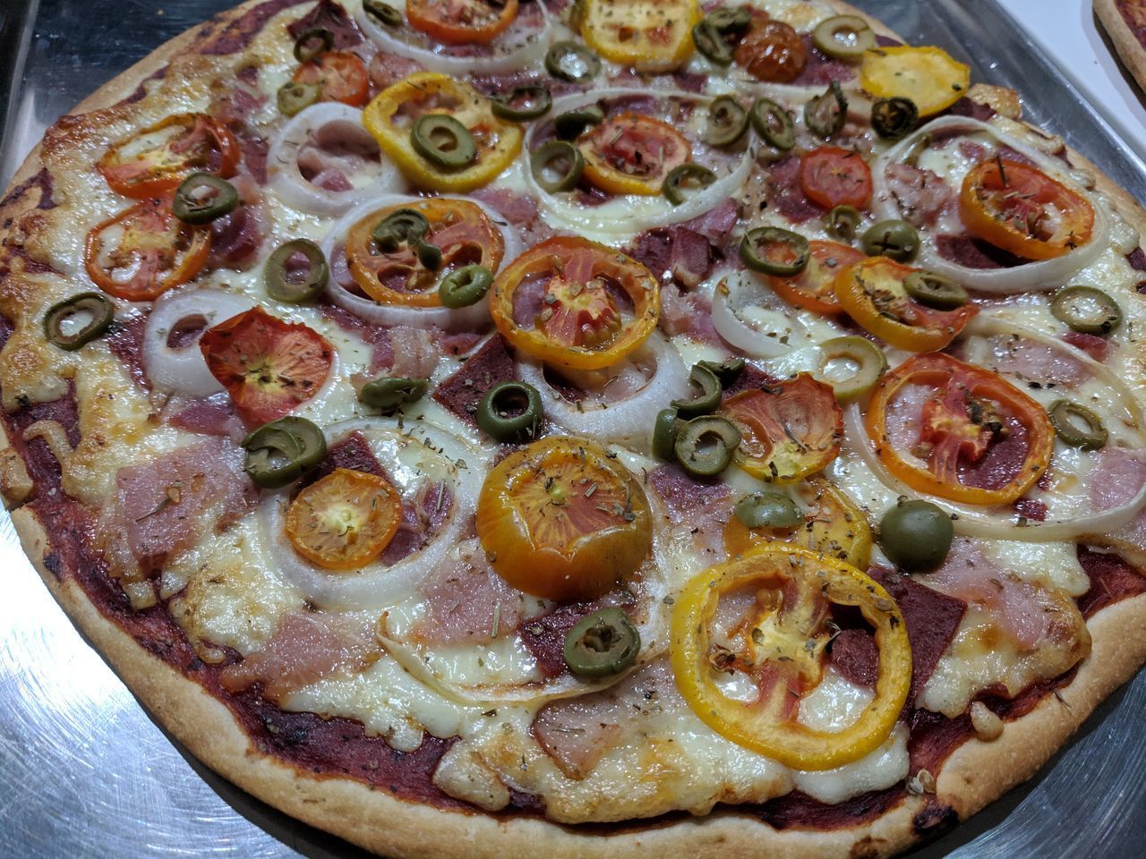 CLOSE-UP OF PIZZA ON TABLE