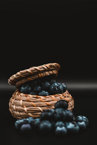 Close-up of cake on table against black background