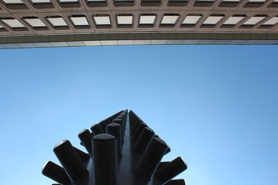 Low angle view of building against clear blue sky