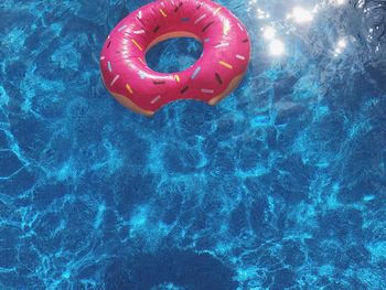 High angle view of inflatable ring floating on swimming pool