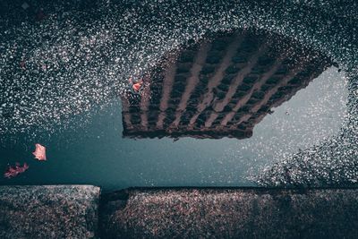 High angle view of puddle on road
