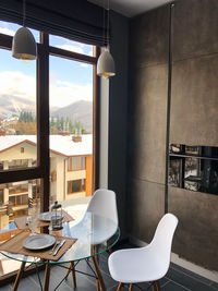 Empty chairs and tables in restaurant