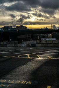 Road against cloudy sky at sunset