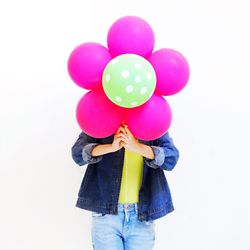 Close-up of red balloons on white background