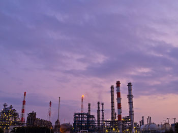 Oil refineries in the evening sky.
